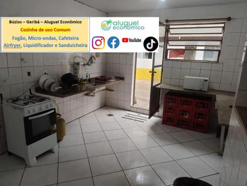 a kitchen with a white tiled floor and a stove at Búzios – Geribá – Suítes - Aluguel Econômico in Búzios