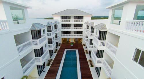 an aerial view of a building with a swimming pool at Mary Beach Hotel & Resort in Sihanoukville