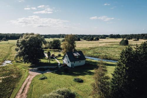 an old house in the middle of a field at Tammearu villa in Kõpu