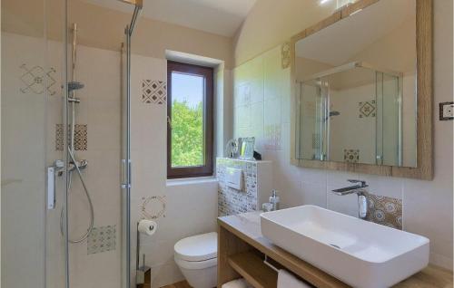 a bathroom with a sink and a shower and a toilet at Villa Botanica Istria in Poreč