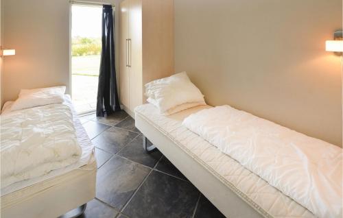 Ένα ή περισσότερα κρεβάτια σε δωμάτιο στο Holiday Home Askemose Vi
