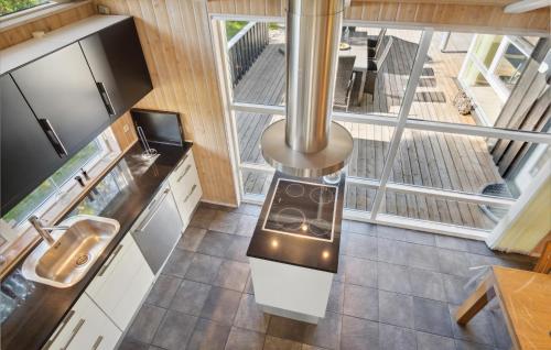 an overhead view of a kitchen with a stove at Holiday Home Hægvej Grenaa Xi in Grenå
