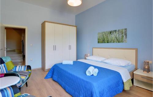a bedroom with a bed with two towels on it at Villa Rachele in Pula