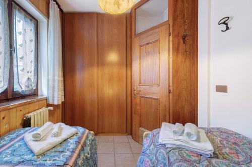 Postel nebo postele na pokoji v ubytování Villa Maria Auronzo