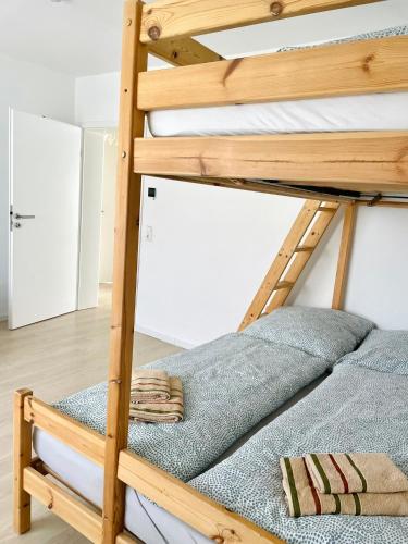 a couple of bunk beds in a room at Schöne Ferienwohnung mitten im Pfälzerwaldgebiet in Leimen
