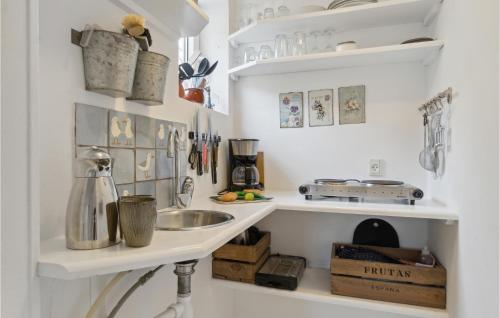 a kitchen with a sink and a counter at Beautiful Apartment In Skagen With Wifi in Skagen