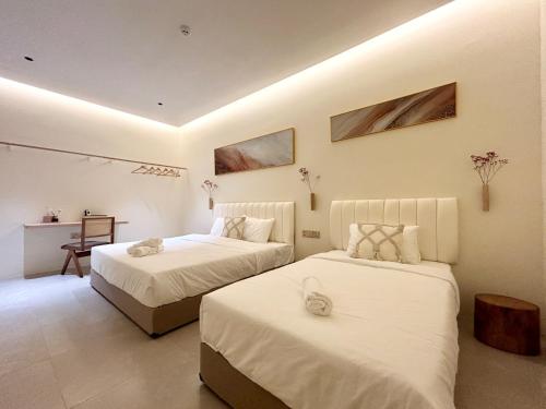Postel nebo postele na pokoji v ubytování ONE18 Boutique Hotel