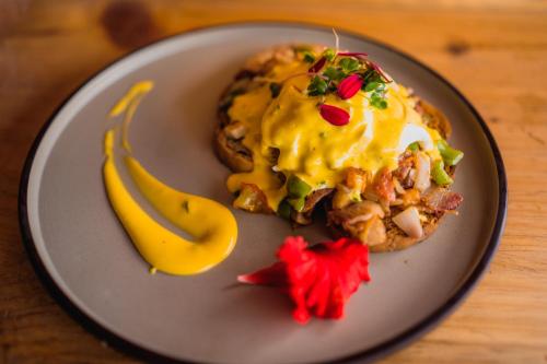 a plate with a breakfast sandwich and a banana at Thamel Heritage Hostel in Kathmandu