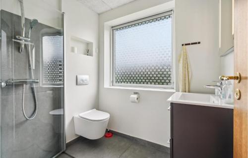 a bathroom with a shower and a toilet and a sink at 3 Bedroom Beautiful Home In Spøttrup in Spottrup