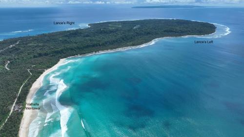 an aerial view of a beach and the ocean at Valhalla Mentawai in Katiet