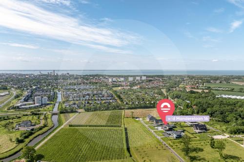 an aerial view of a city with a stop sign at Welcome in - Luxe vakantiewoningen nabij strand ZEEBRIES - Dishoek in Koudekerke