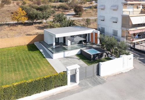 an aerial view of a house with a swimming pool at Prive Studio in Thessaloniki