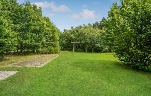 an empty field with trees and a soccer goal at 4 Bedroom Stunning Home In Glesborg in Glesborg