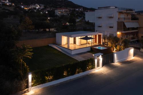 a view of a house at night with lights at Prive Studio in Thessaloniki
