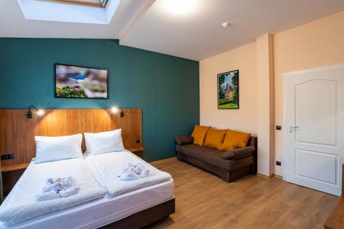 Ένα ή περισσότερα κρεβάτια σε δωμάτιο στο Simada Center Guesthouse