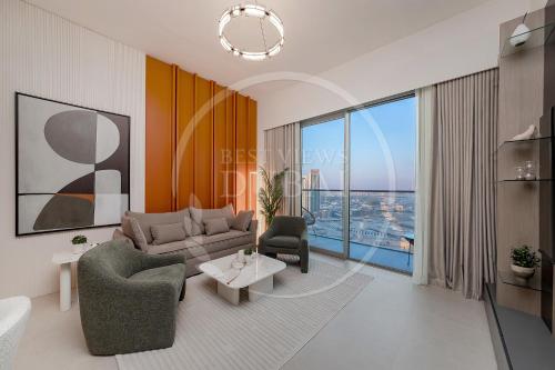 a living room with a couch and a table at Prime Burj Khalifa&Fountain Views 2 Bdr Apartment in Dubai
