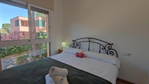 a bedroom with a large bed with a teddy bear on it at VILLAS COSETTE Villa Cami de les Penyes in GRO