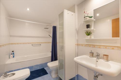 a bathroom with a sink and a toilet and a shower at Paradise Beach Bay in Adeje
