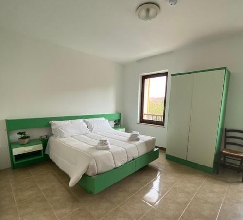 En eller flere senge i et værelse på Alloggio La Pesa