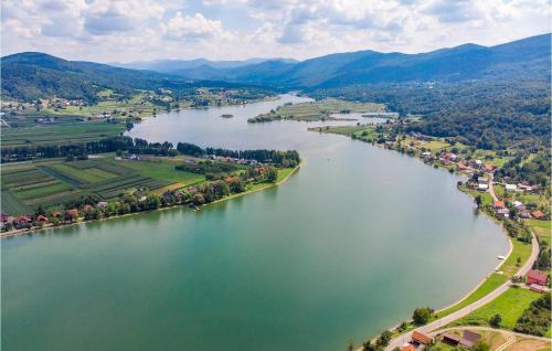 an aerial view of a river with a town at Two-Bedroom Apartment In Ogulin in Jasenak