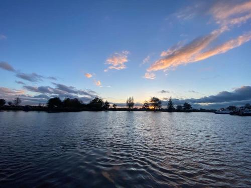 a view of a large body of water at sunset at Dobberhuisje in IJsselstein