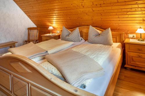 a bedroom with two beds with pillows on them at Ferienhaus Brigitte - Breitnau in Breitnau