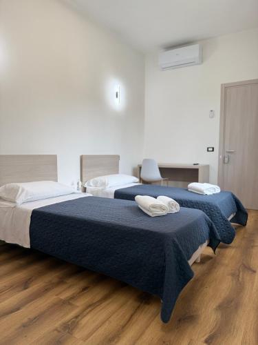 Katil atau katil-katil dalam bilik di Infinity House - Eleganza Moderna tra Treviso e Venezia