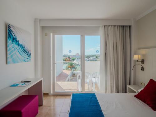 Postel nebo postele na pokoji v ubytování Hotel La Santa Maria
