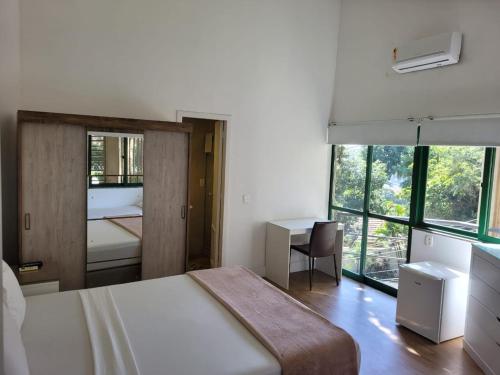 Ένα ή περισσότερα κρεβάτια σε δωμάτιο στο Sant' Martre
