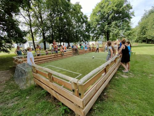 a group of people playing a game of tennis at Glamping Borken in Borken