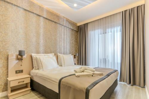 Postel nebo postele na pokoji v ubytování Olea Suites Otel