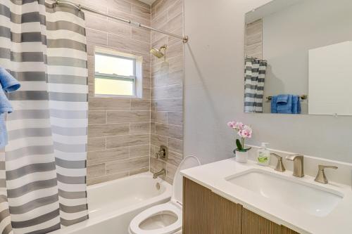 a bathroom with a sink and a toilet and a shower at 4 Mi to Golf Quiet Lake Wales Retreat in Indian Lake Estates