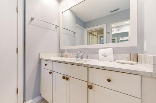 a bathroom with a sink and a mirror at Inlet Cove 11 in Kiawah Island