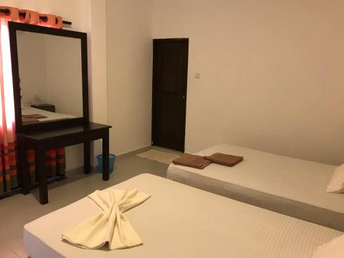 Katil atau katil-katil dalam bilik di Lavendra Villa Mirissa