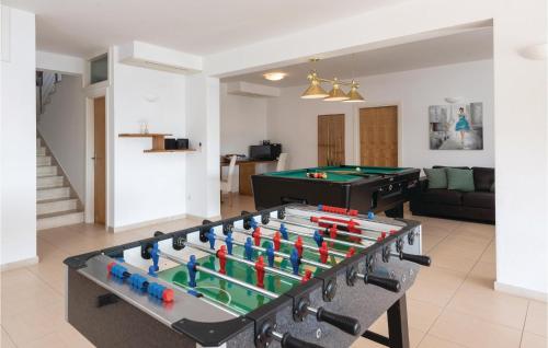 a living room with a pool table and ping pong at Nice Home In Prizba With Sauna in Prizba