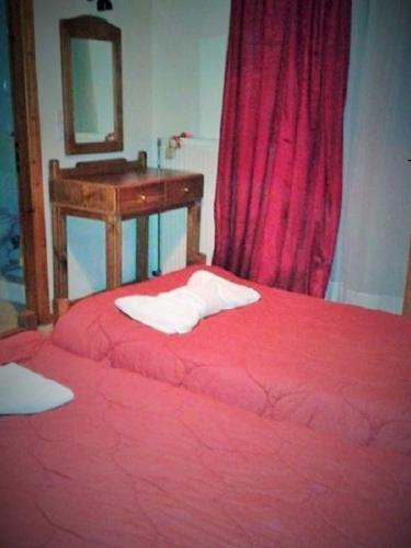 Ένα ή περισσότερα κρεβάτια σε δωμάτιο στο Elatos Rooms