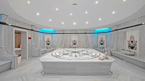 a large room with a large white room with blue lights at Crowne Plaza Bursa Convention Center & Thermal Spa by IHG in Bursa