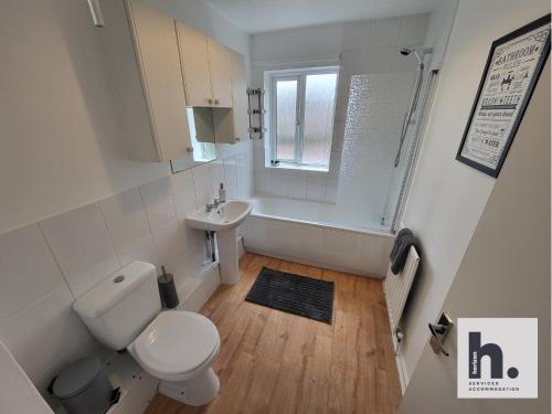 a bathroom with a toilet and a sink and a shower at FREE Parking - Waterfront - Relocators - ST in Hull