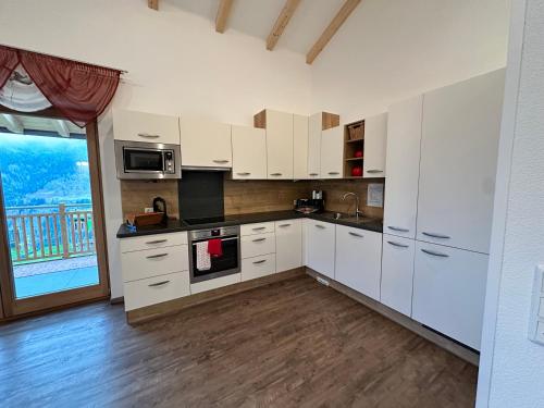 Kuchyň nebo kuchyňský kout v ubytování Panoramablick Tscheltsch