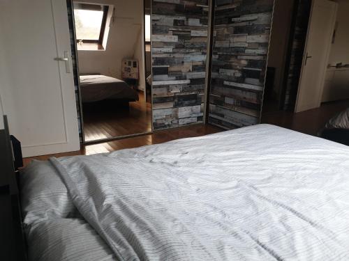 En eller flere senge i et værelse på Sur les toits du centre