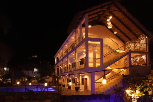 a building with lights on it at night at Bungalows Zicatela in Puerto Escondido