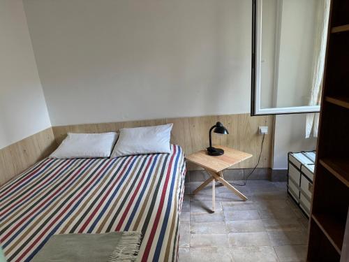 Ένα ή περισσότερα κρεβάτια σε δωμάτιο στο Birbantes 21