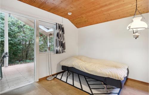 Beautiful Home In Tarm With Wifiにあるベッド