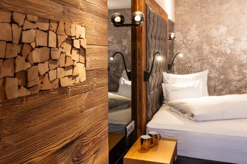 Posteľ alebo postele v izbe v ubytovaní Hotel Innsbruck
