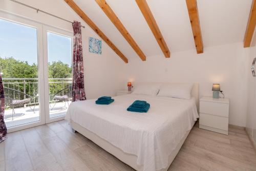 Postel nebo postele na pokoji v ubytování Apartments Srdanovic