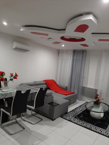 a living room with a couch and a table at Joyce City in Knutange