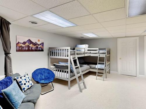 a room with two bunk beds and a couch at Starlit Memories in Swanton