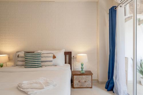 Ένα ή περισσότερα κρεβάτια σε δωμάτιο στο Affcasa Apartments
