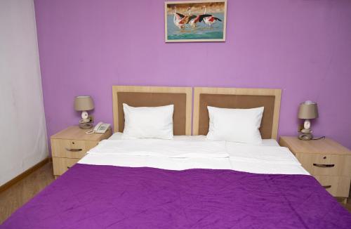 Ένα ή περισσότερα κρεβάτια σε δωμάτιο στο Flamingo Hotel Baku