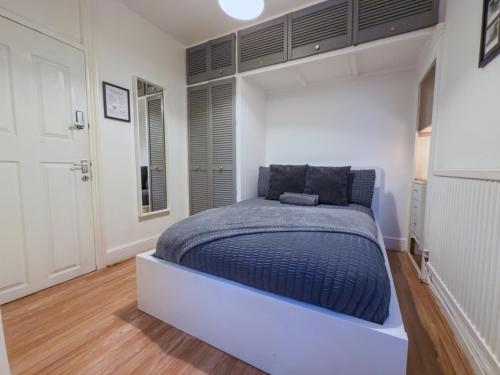 Ένα ή περισσότερα κρεβάτια σε δωμάτιο στο Liberty Stockwell Rooms